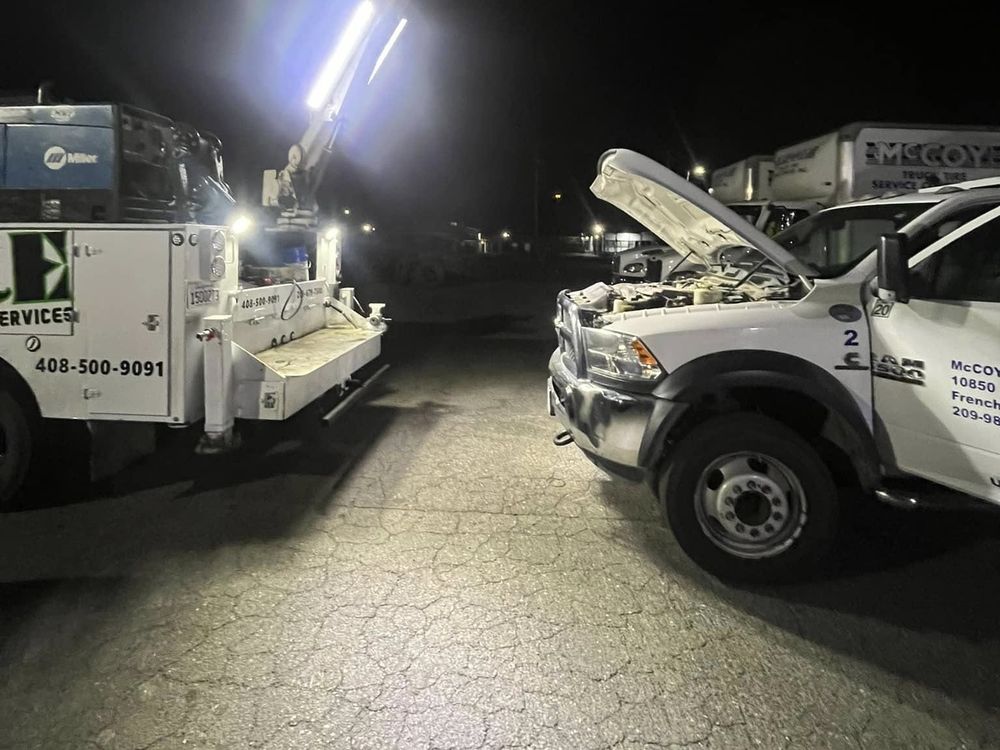 L&E service truck lighting up a nighttime repair call