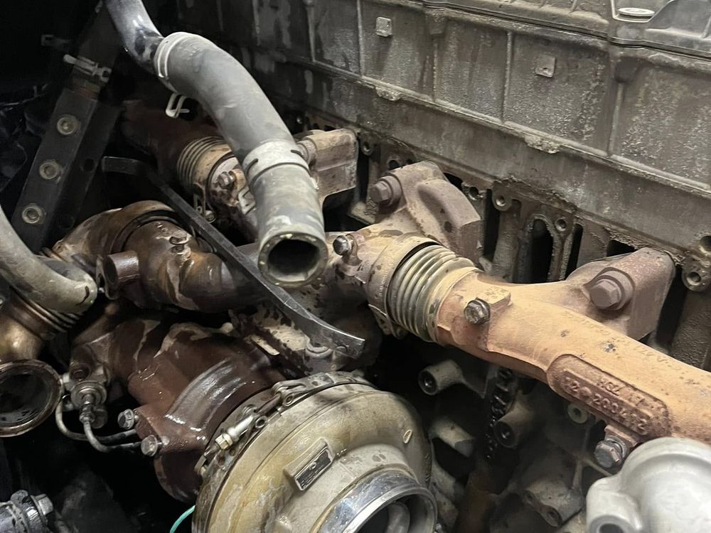 Turbocharger and exhaust components exposed during a diesel engine repair